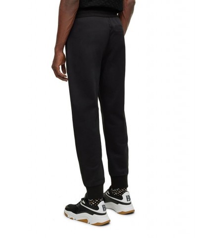 BOSS Men's Monogram-Filled Logo Tracksuit Bottoms Black $73.78 Pants